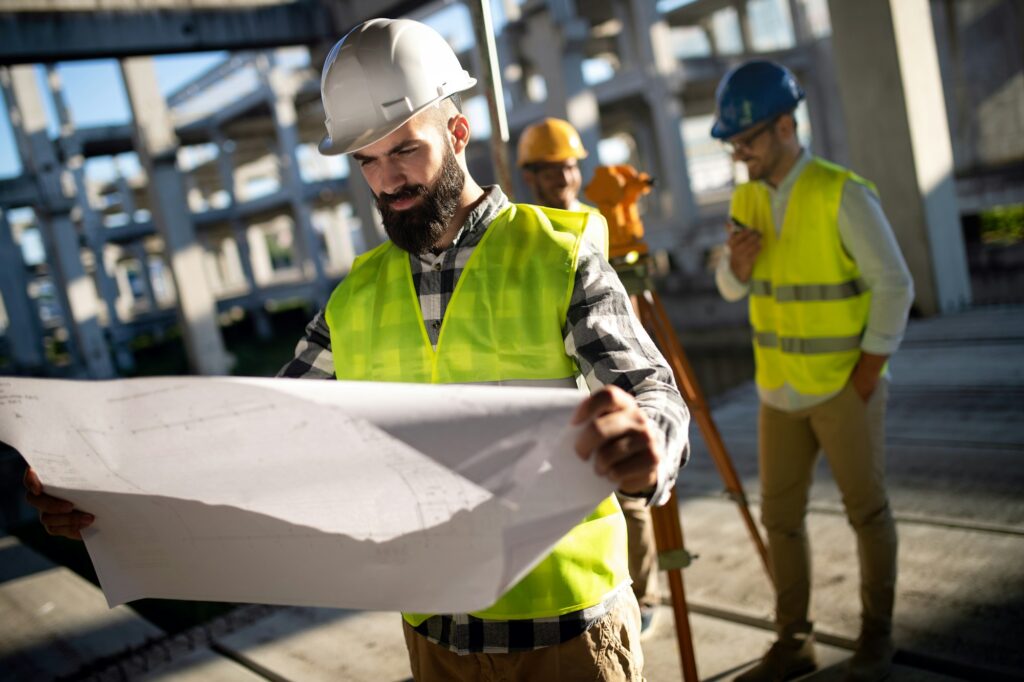 Construction concept of engineer and architect working at construction site